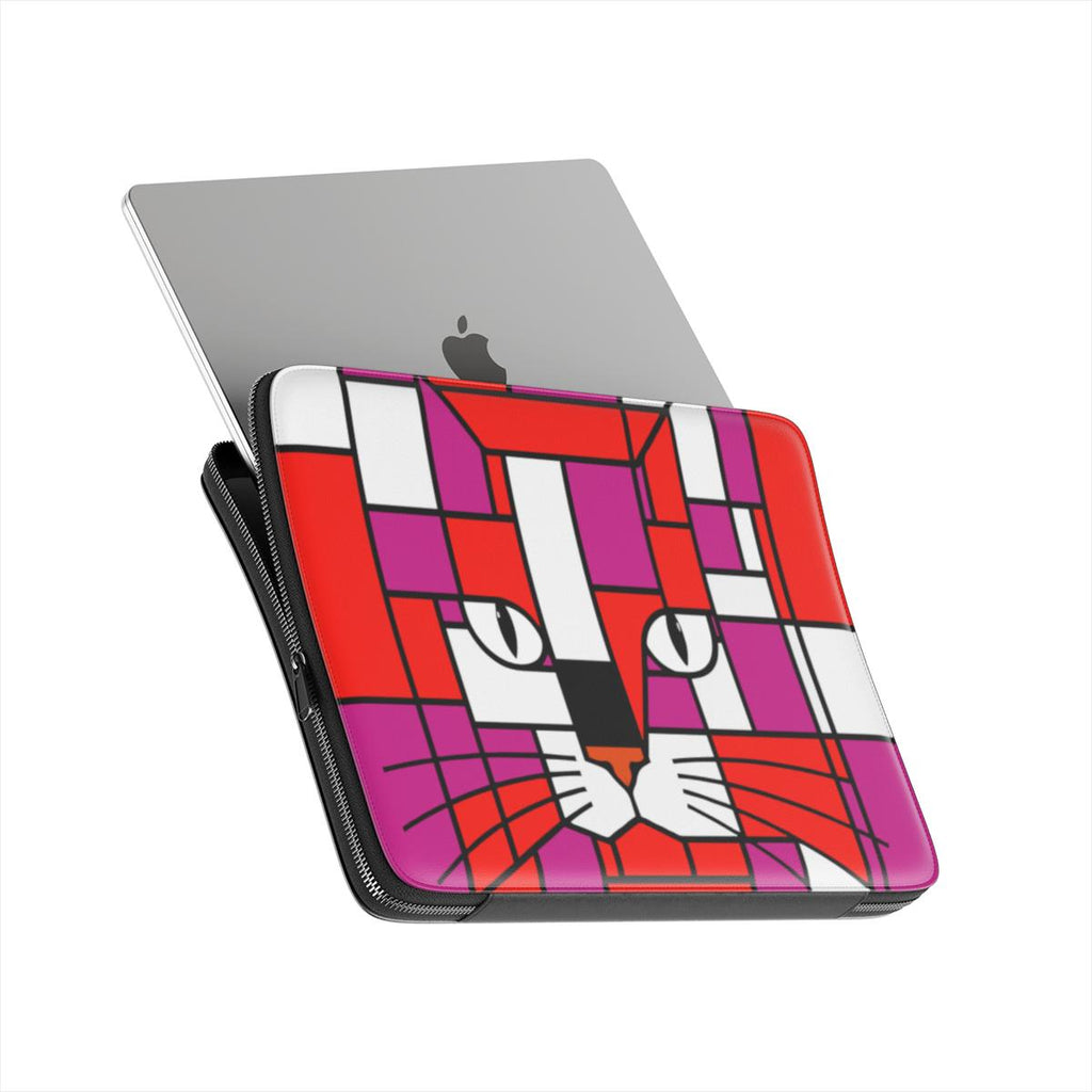 Premium laptop sleeve featuring a geometric cat face design in blood orange, neon red and purple, shown from the front angle