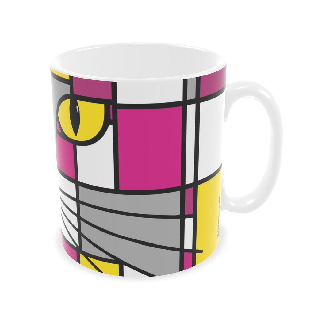 A white ceramic mug featuring a colorful geometric cat face design in a Piet Mondrian-inspired style with magenta, yellow, gray, and black blocks.