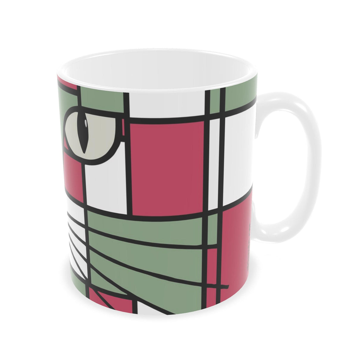 A white ceramic mug featuring a modern, abstract geometric cat face design in a Mondrian-style color block pattern of pink, sage green, white, and black.