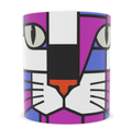 A white ceramic mug featuring a geometric cat face design in a pop-art style with purple, magenta, blue, black, white, and orange colors.