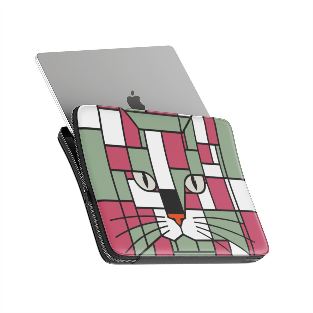 exteriordetail of the red, terracotta, forest green and olive geometric cat face premium laptop sleeve showing the padded lining and protective construction.