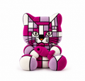 A stylized plush cat toy in a geometric mosaic pattern of magenta pink, lavender purple, and white, holding a matching pink fish on a white background.